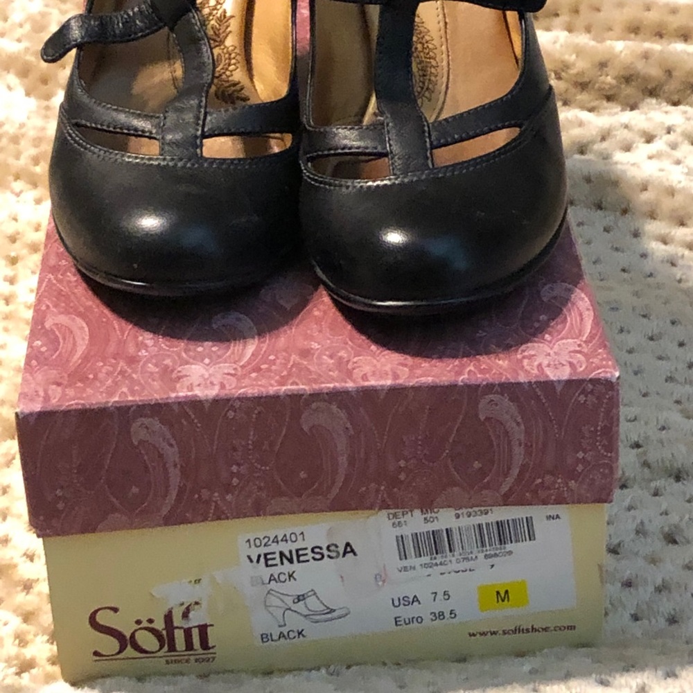 A pair of Black Sofft heels.